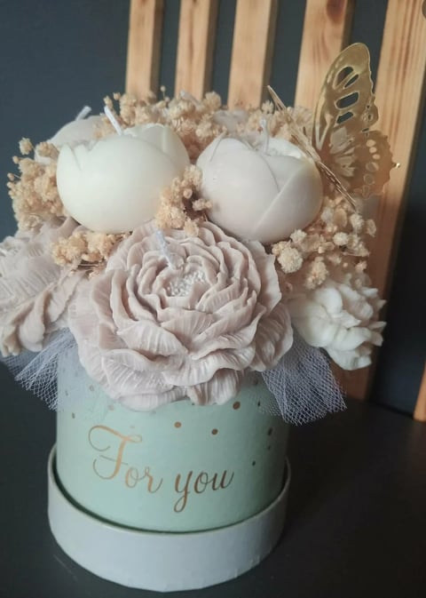 Decorative floral arrangement in mint green box with blush roses, babys breath, white eggs, and gold butterfly with For you text